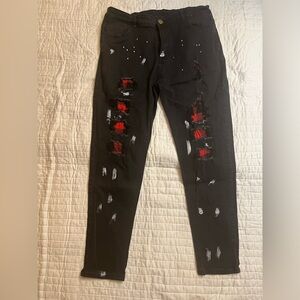 Black paint splatter ripped jeans